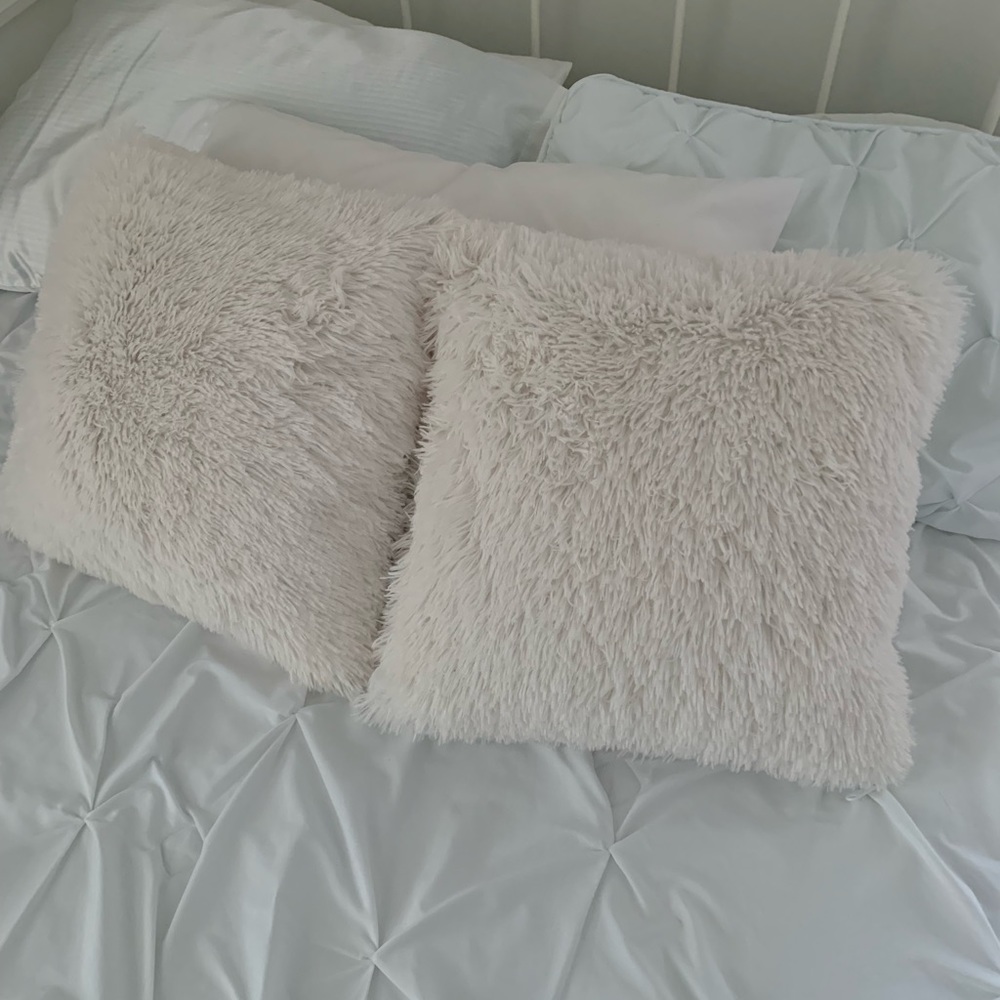 Fluffy white throw pillows